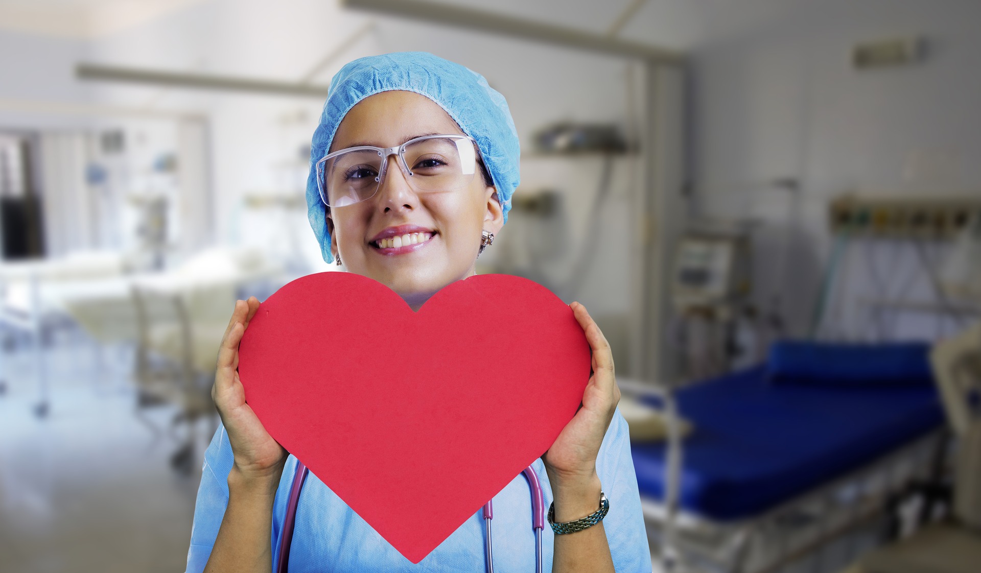 Doctor Holding Red Heart-shaped Cutout