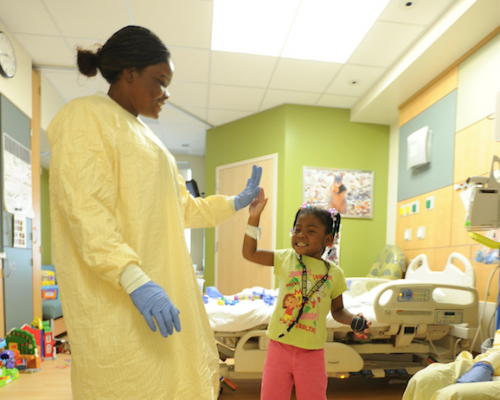 Doctor high-fiving child patient