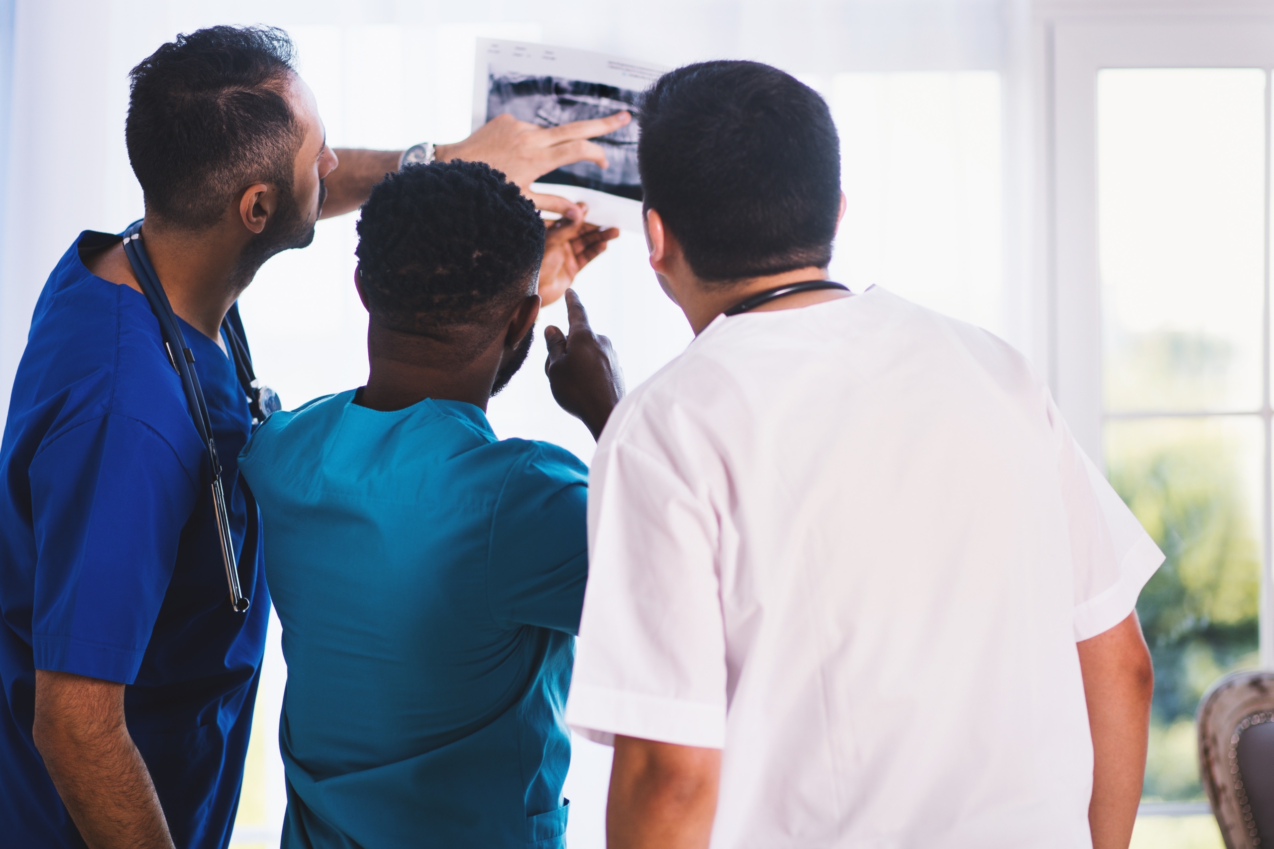 Doctors looking at X-ray Image