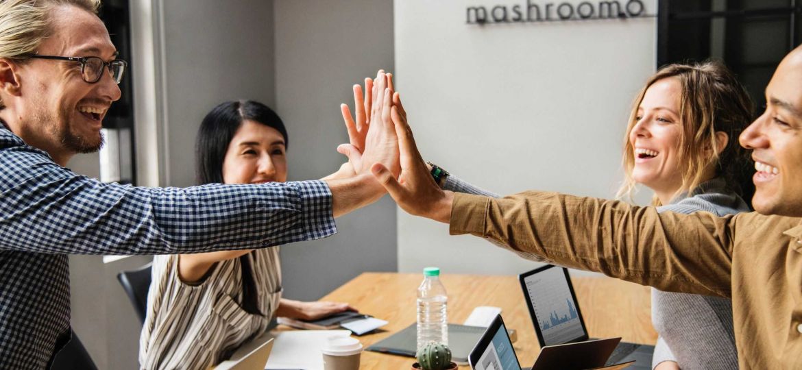 Team High Five in Office Image