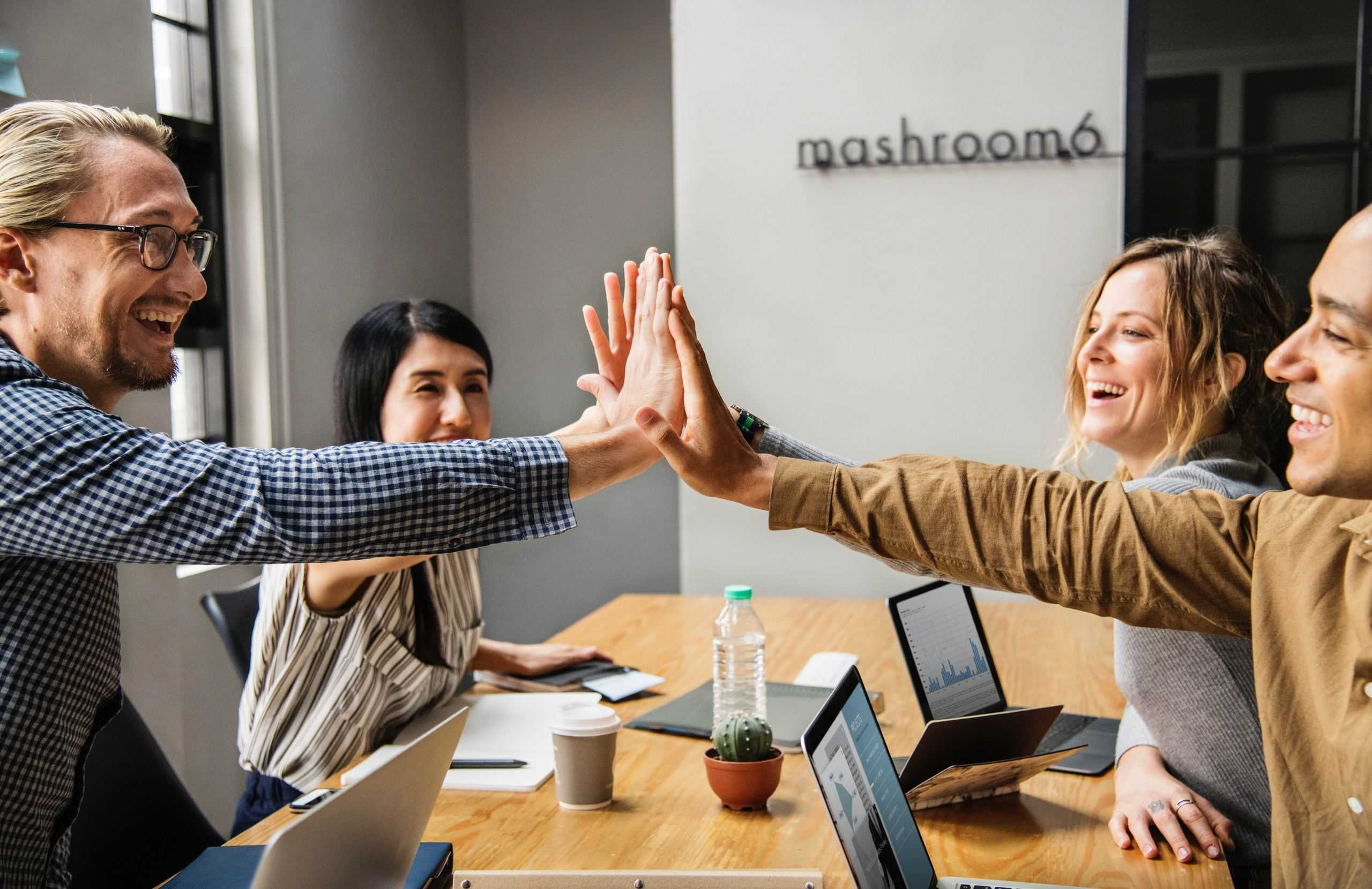 Team High Five in Office Image