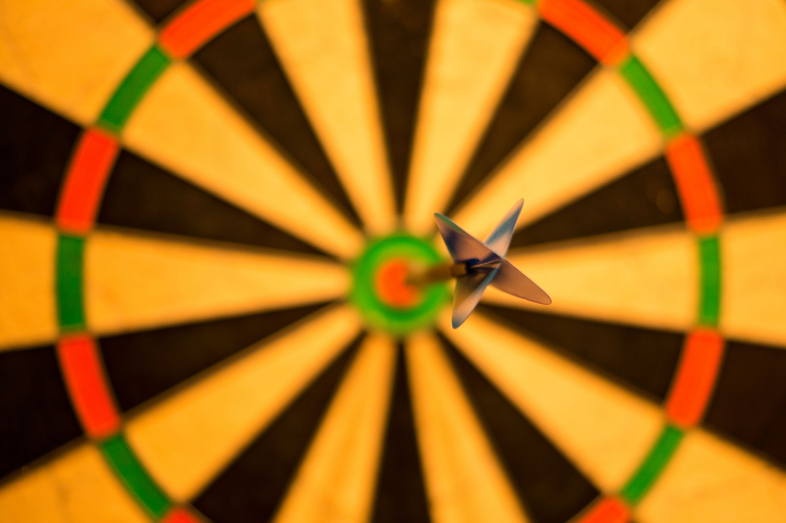 dart hitting center of dart board