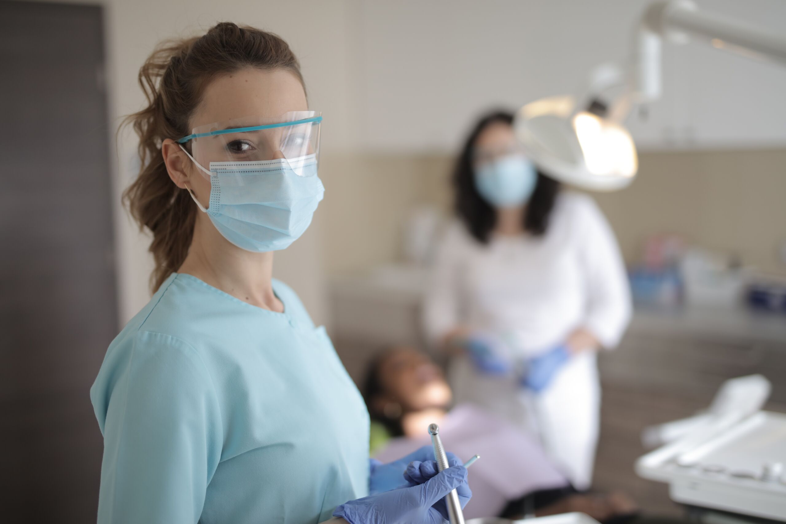 young-female-dentist-in-medical-uniform-with-instruments-3881301 dental assistant