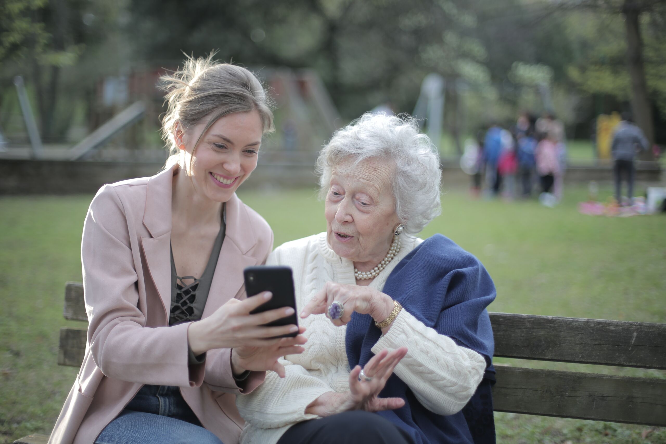 Woman sitting with elderly woman