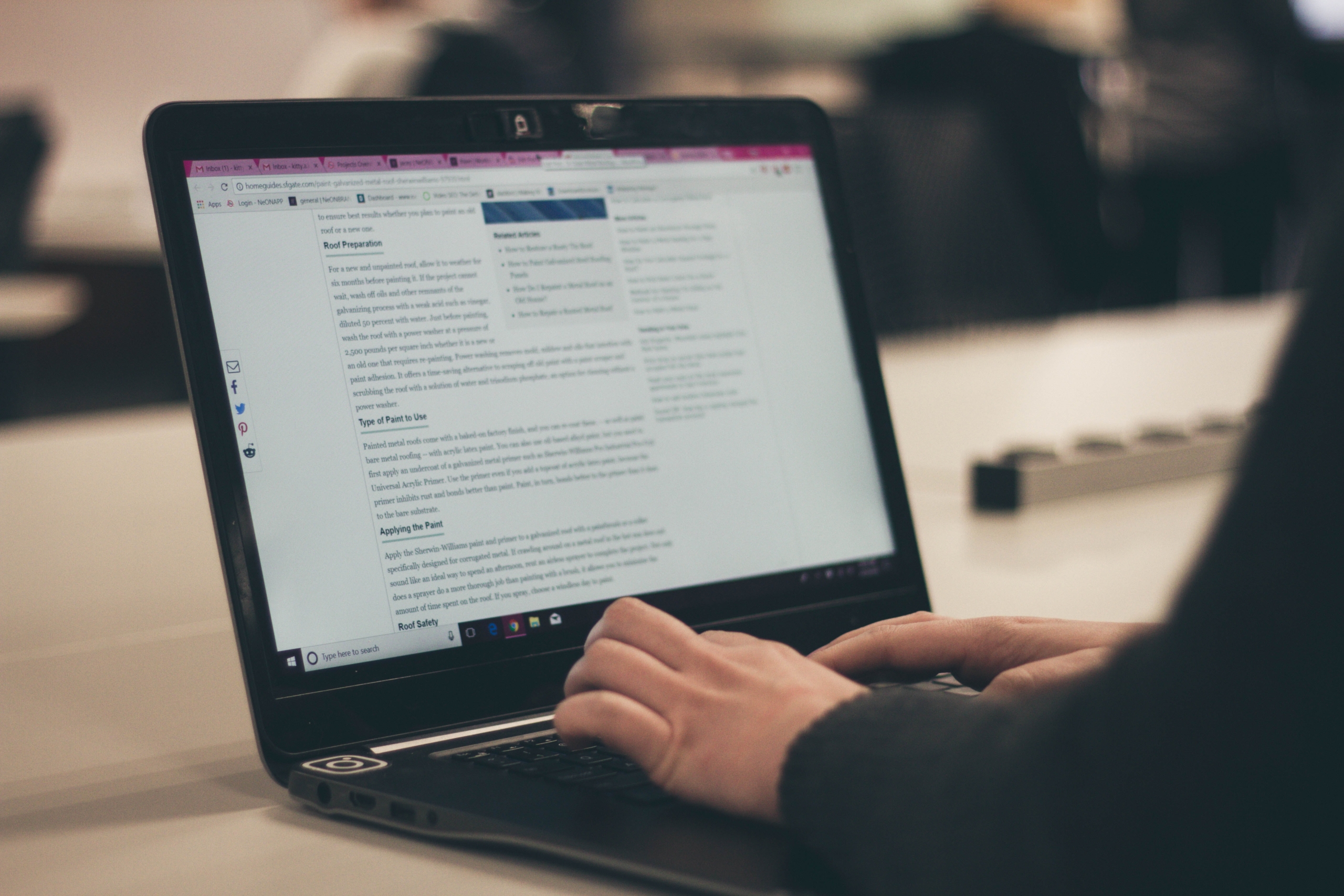 Person writing content on a computer